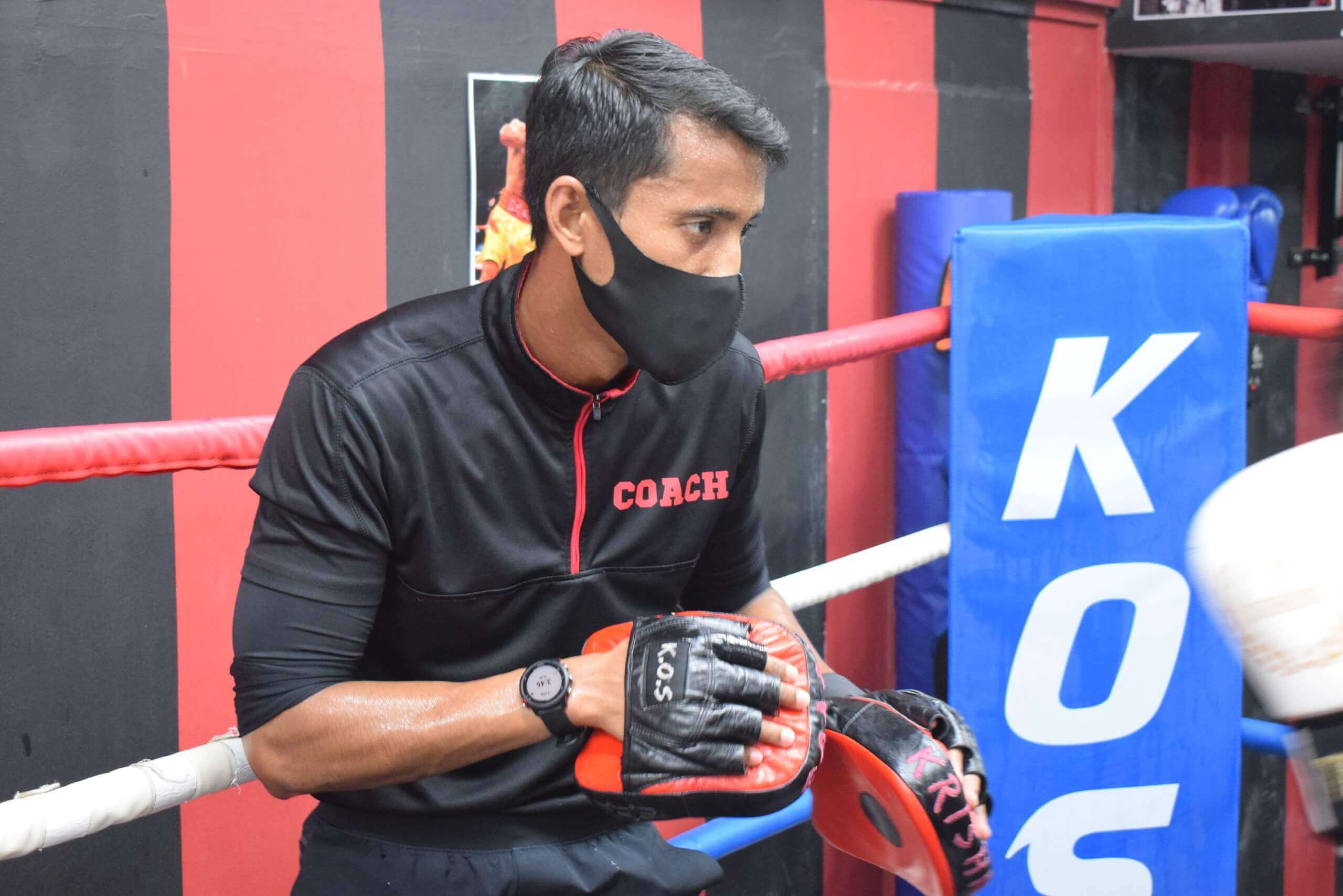 Coach Ravi perfecting his boxing technique with focused punches.