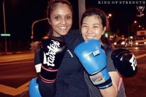 Two Female Boxers Posing with Boxing Gloves