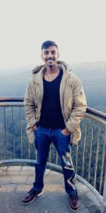 Coach Kumar enjoying a scenic view from the balcony