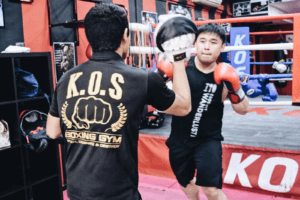 Focused punch practice at KOS Boxing Gym